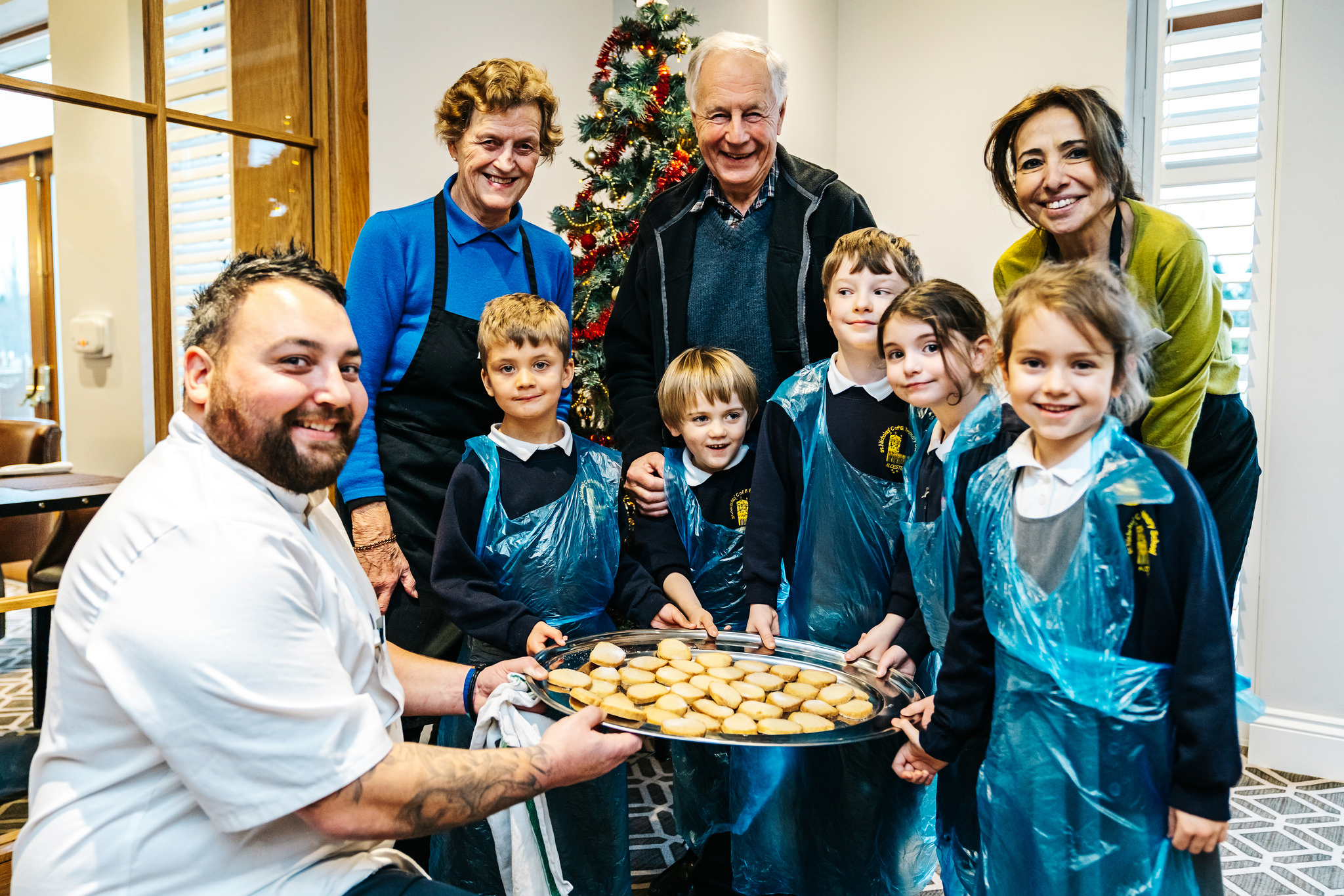 Chef teaches school children how to bake for retirement community's Christmas tea party