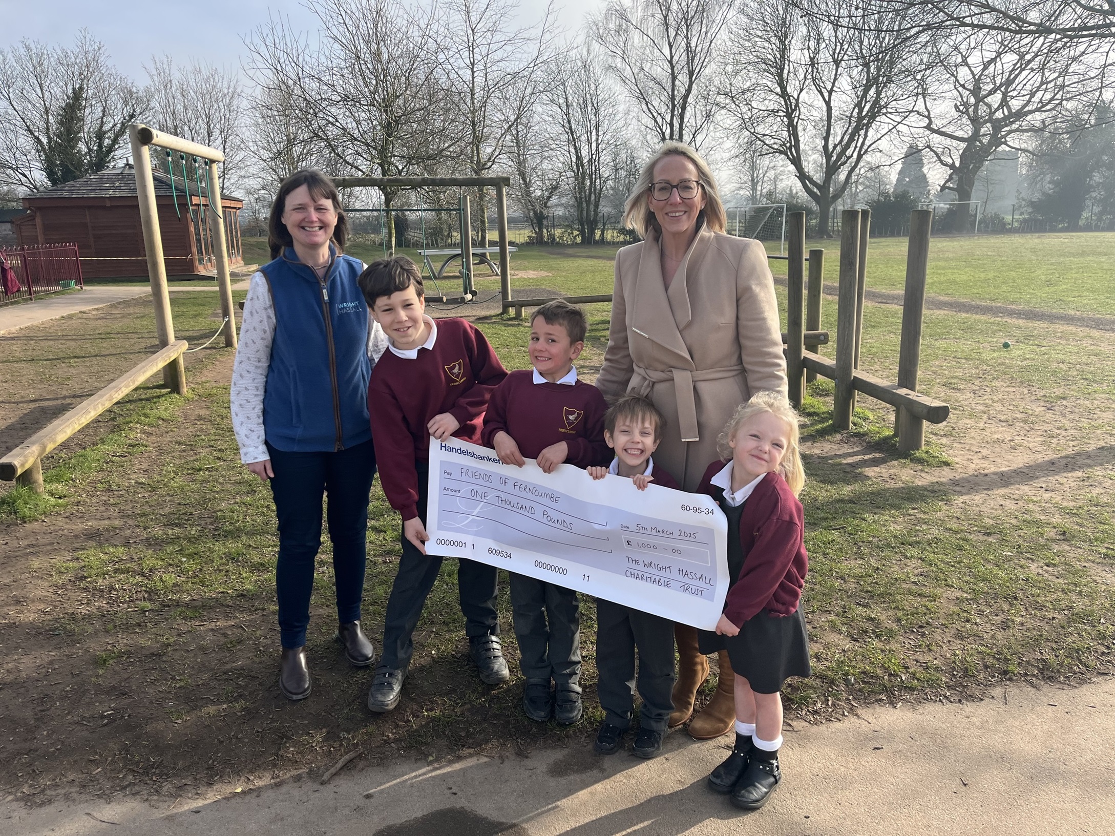 Leading Leamington law firm presents bumper donation to Warwickshire school 